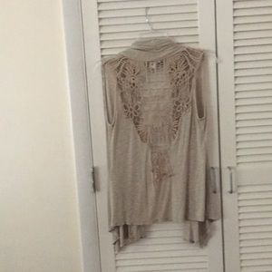 Cute Beige sleeveless jacket.